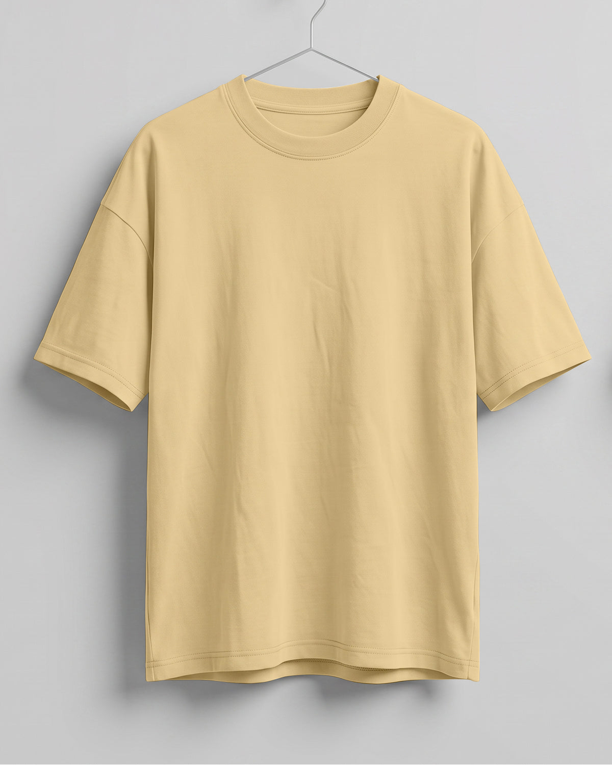 Beige oversized plain half sleeve round neck t-shirt made from premium cotton 180 GSM red label yarn, biowashed for softness.