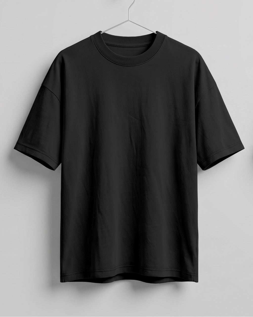 Black oversized plain half sleeve round neck t-shirt made from premium cotton 180 GSM red label yarn, biowashed for softness.