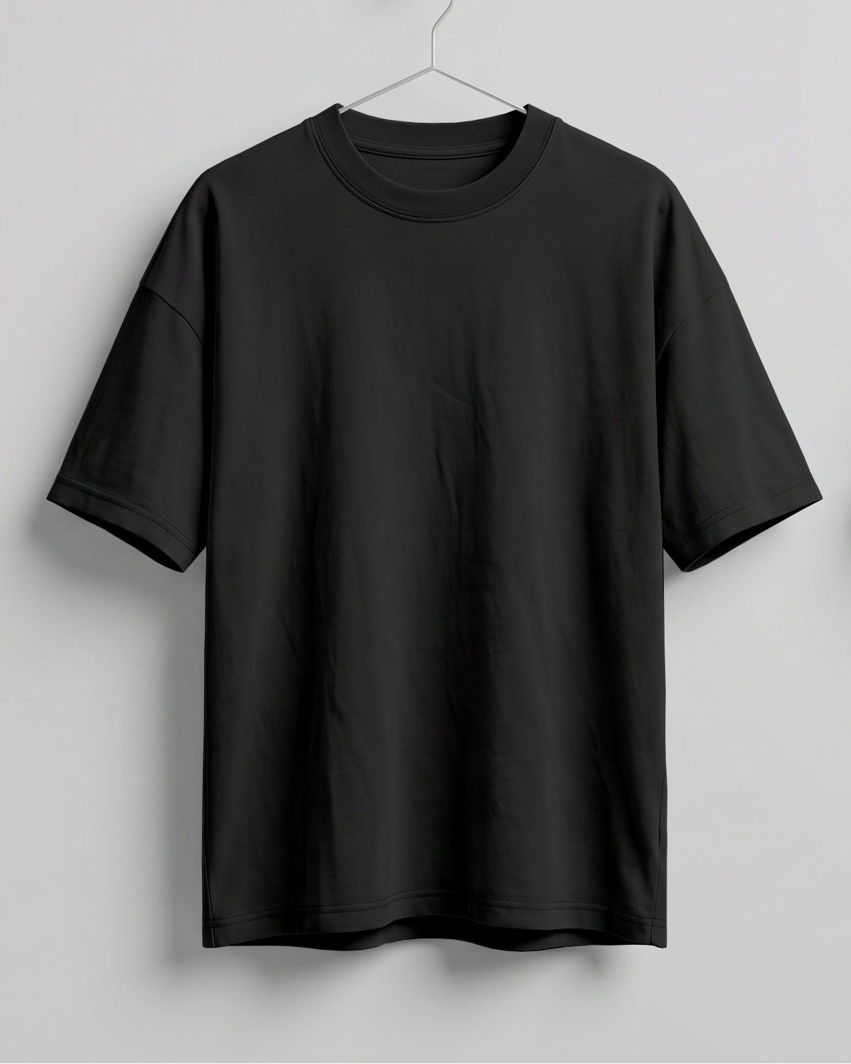 Black oversized plain half sleeve round neck t-shirt made from premium cotton 180 GSM red label yarn, biowashed for softness.