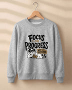 Motivational graphic sweatshirt featuring relaxed cat wearing sunglasses artwork with Focus on Progress, Not Perfection quote printed on cotton fabric
