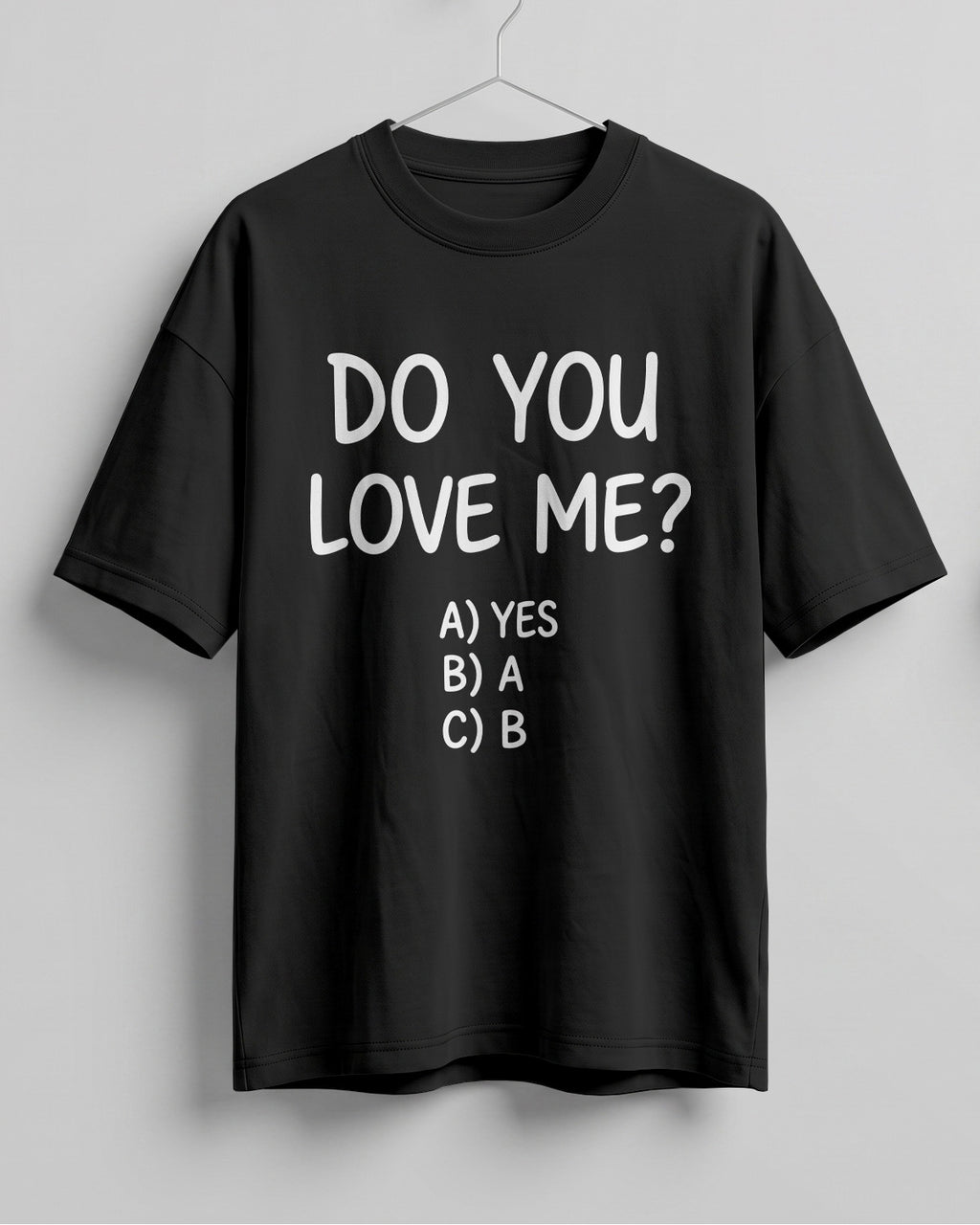 Funny graphic half sleeve oversized t-shirt featuring Do You Love Me? quote with cheeky multiple choice options on cotton fabric