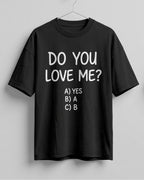 Funny graphic half sleeve oversized t-shirt featuring Do You Love Me? quote with cheeky multiple choice options on cotton fabric