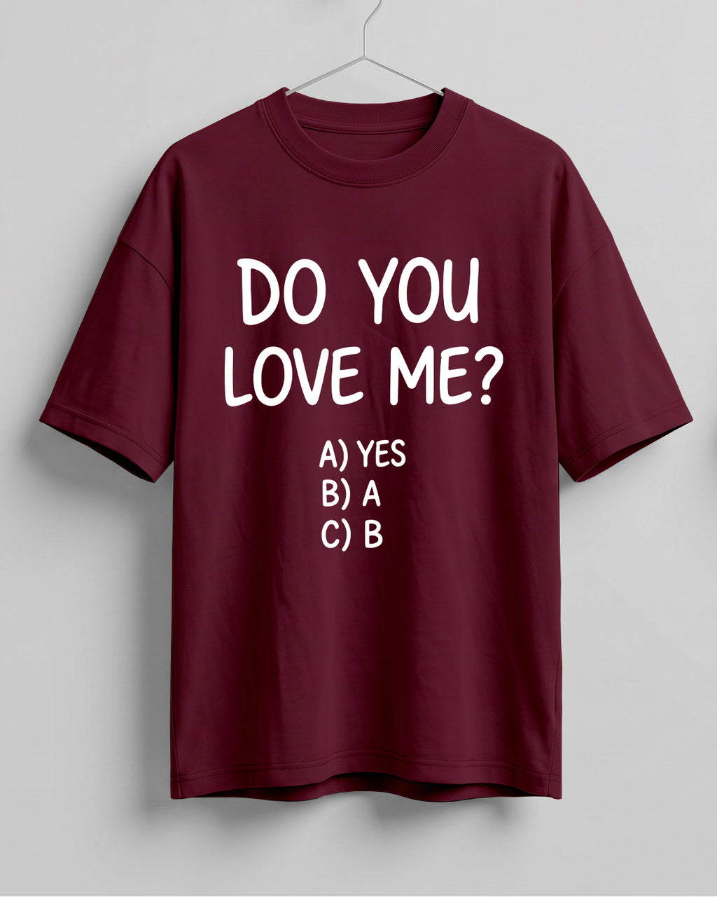 Funny graphic half sleeve oversized t-shirt featuring Do You Love Me? quote with cheeky multiple choice options on cotton fabric