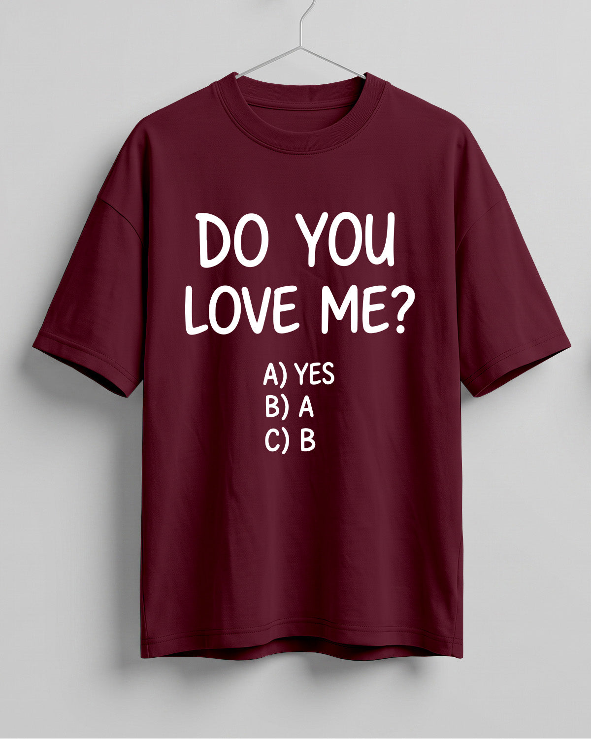 Funny graphic half sleeve oversized t-shirt featuring Do You Love Me? quote with cheeky multiple choice options on cotton fabric