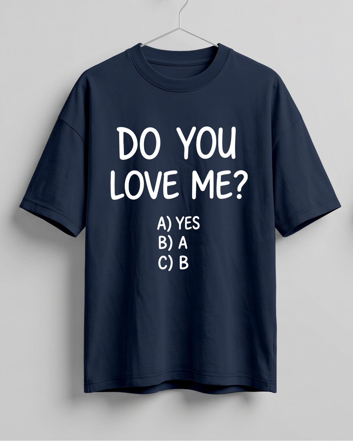 Funny graphic half sleeve oversized t-shirt featuring Do You Love Me? quote with cheeky multiple choice options on cotton fabric