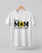 Mom quote graphic half sleeve t-shirt featuring “Being a MOM makes my life complete” with sunflower design