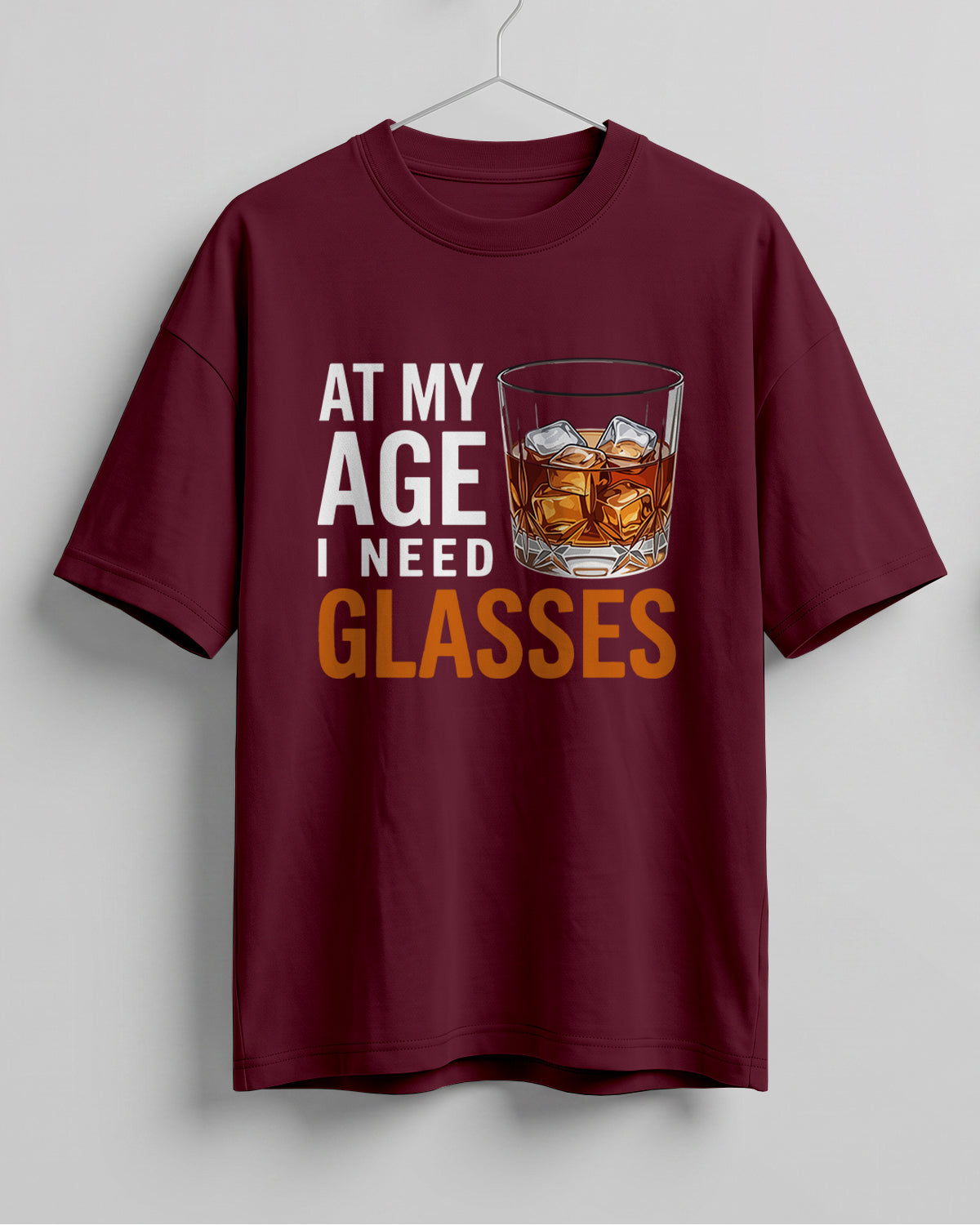 Xenovaurban oversized T-shirt featuring At My Age I Need Glasses quote and illustrated whiskey glass