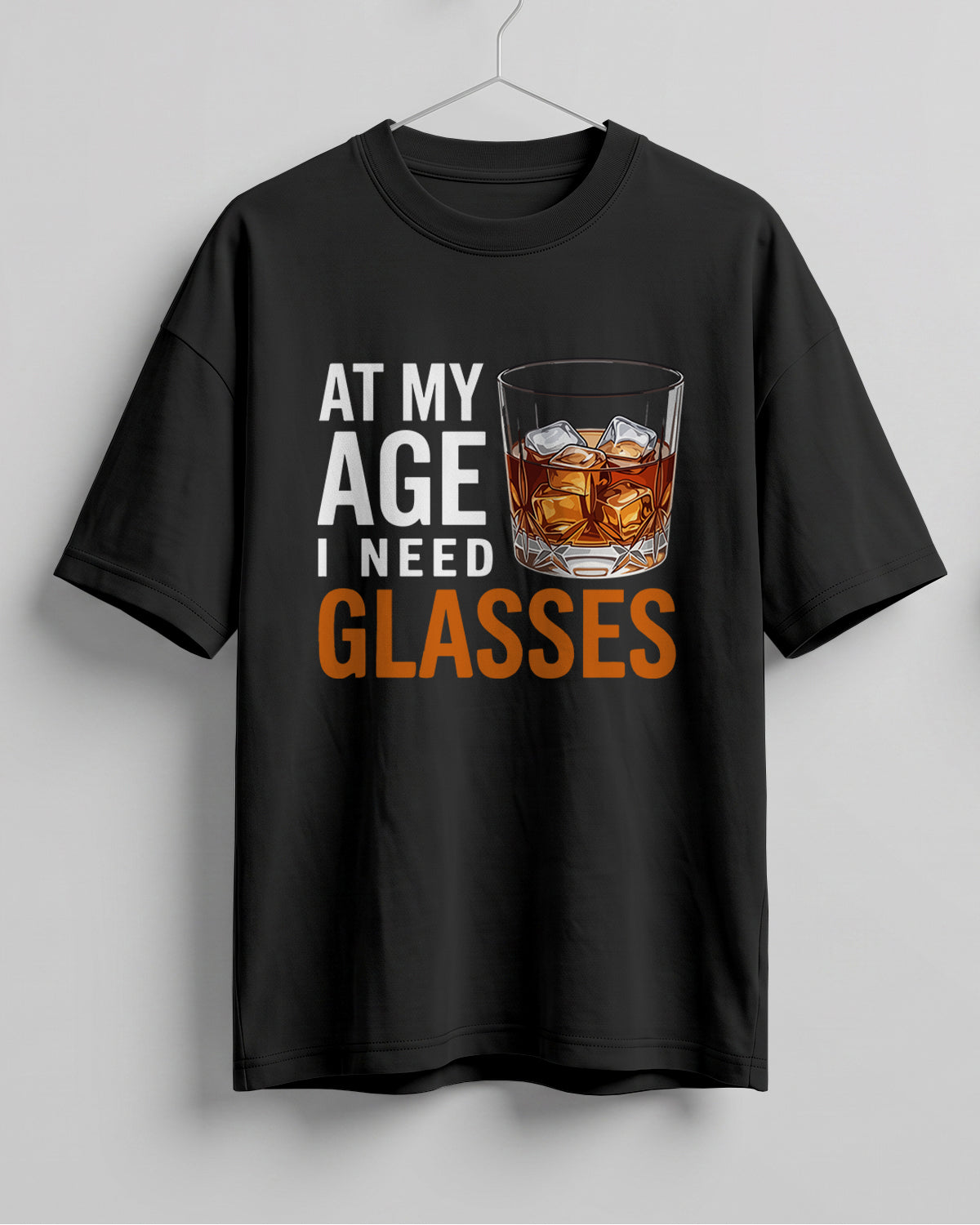 Xenovaurban oversized T-shirt featuring At My Age I Need Glasses quote and illustrated whiskey glass
