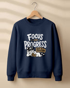 Motivational graphic sweatshirt featuring relaxed cat wearing sunglasses artwork with Focus on Progress, Not Perfection quote printed on cotton fabric