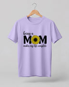Mom quote graphic half sleeve t-shirt featuring “Being a MOM makes my life complete” with sunflower design