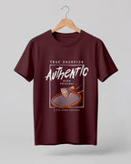 Motivational sports graphic half sleeve t-shirt featuring badminton racket and shuttlecock with “True Champion Authentic Born Original A Team Works Together” typography design on premium cotton fabric.