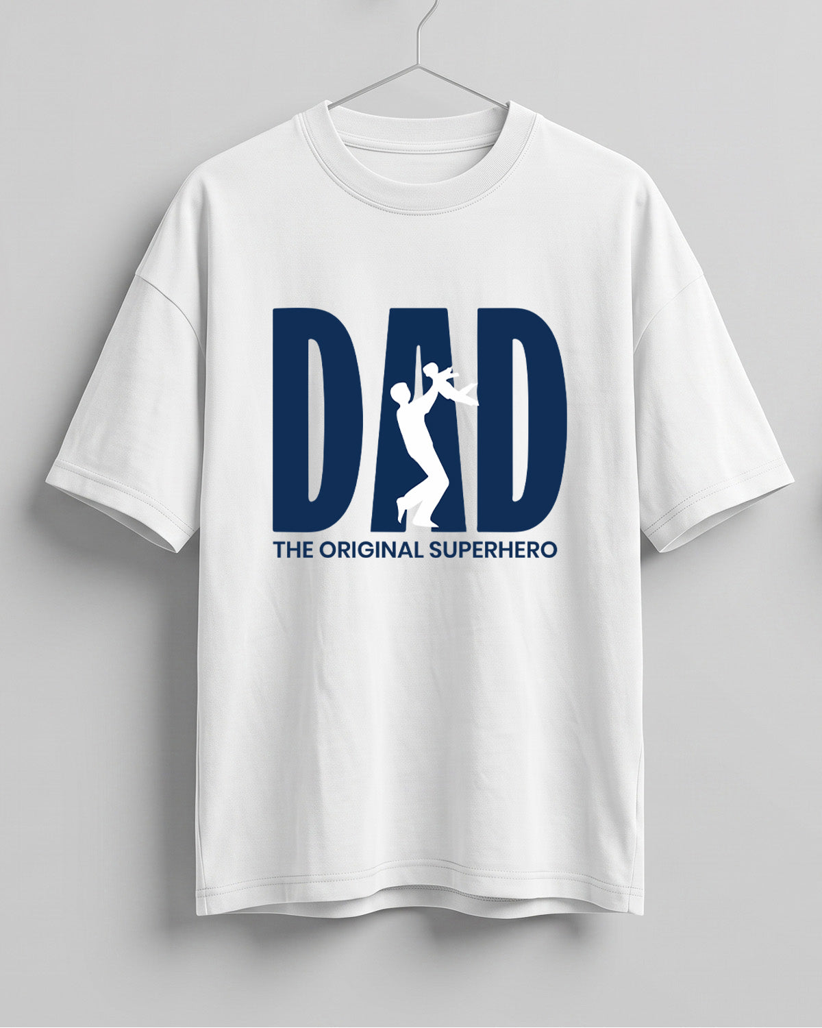 Oversized unisex t-shirt with “Dad – The Original Superhero” typography print, crafted from 220 GSM cotton, bio‑washed and pre‑shrunk.