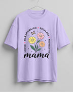 Xenovaurban oversized graphic T-shirt featuring Mama typography, colourful flowers, and words celebrating a mother's love and care