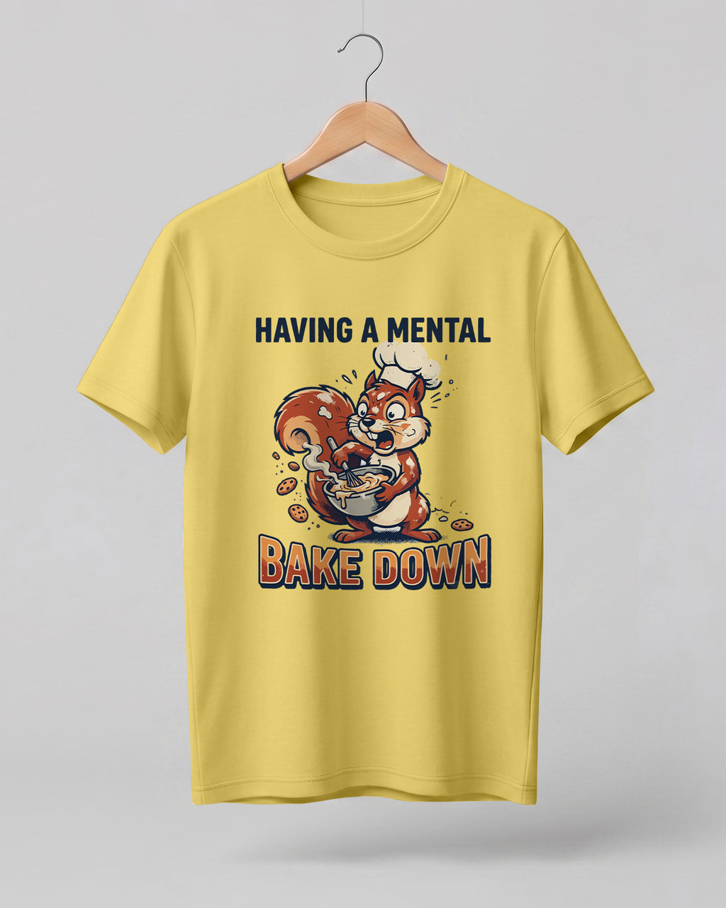 Foodie graphic half sleeve t-shirt featuring cartoon squirrel baking illustration with “Having a Mental Bake Down” typography printed on premium cotton fabric.
