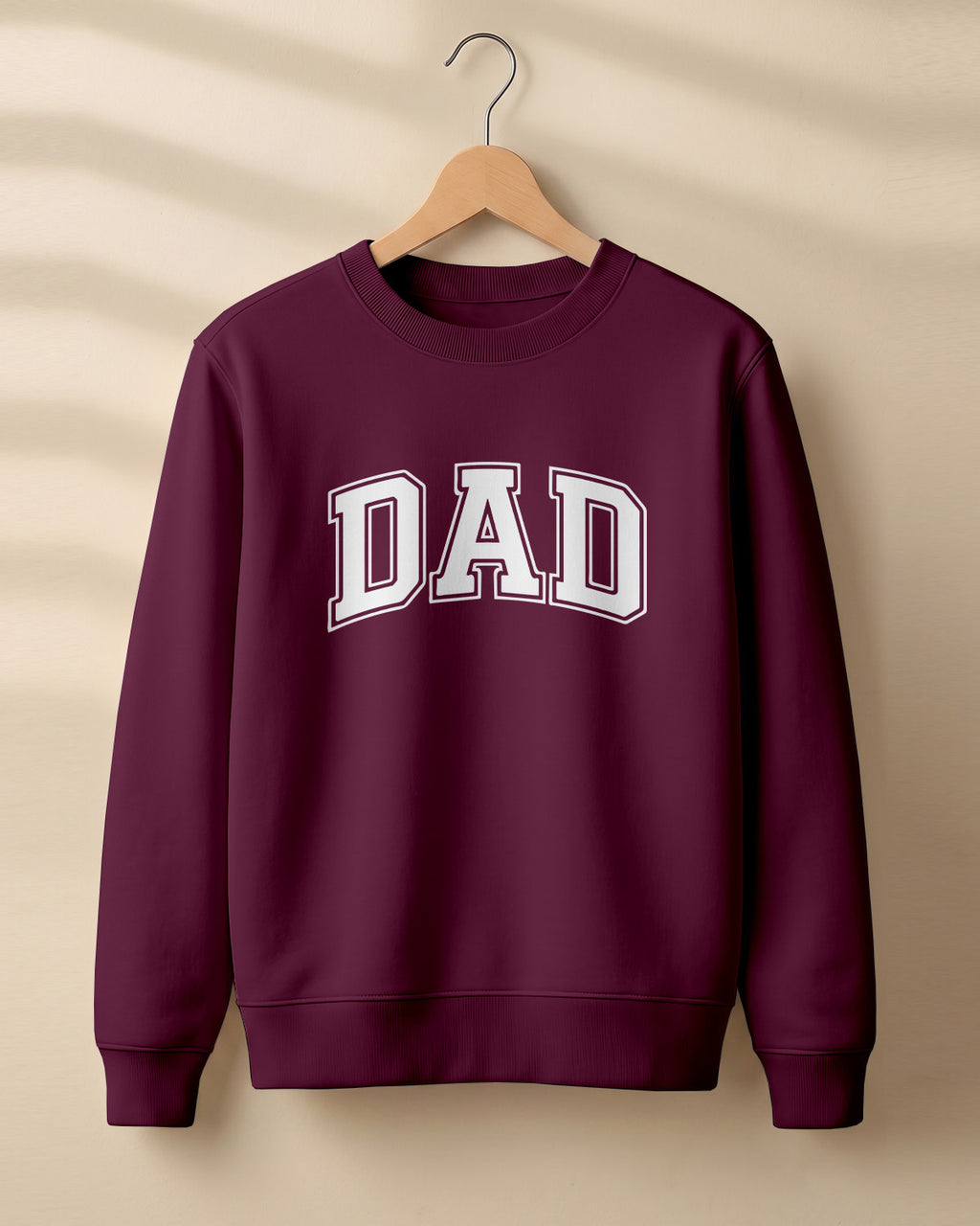 Xenovaurban graphic sweatshirt featuring bold varsity-style “DAD” typography.