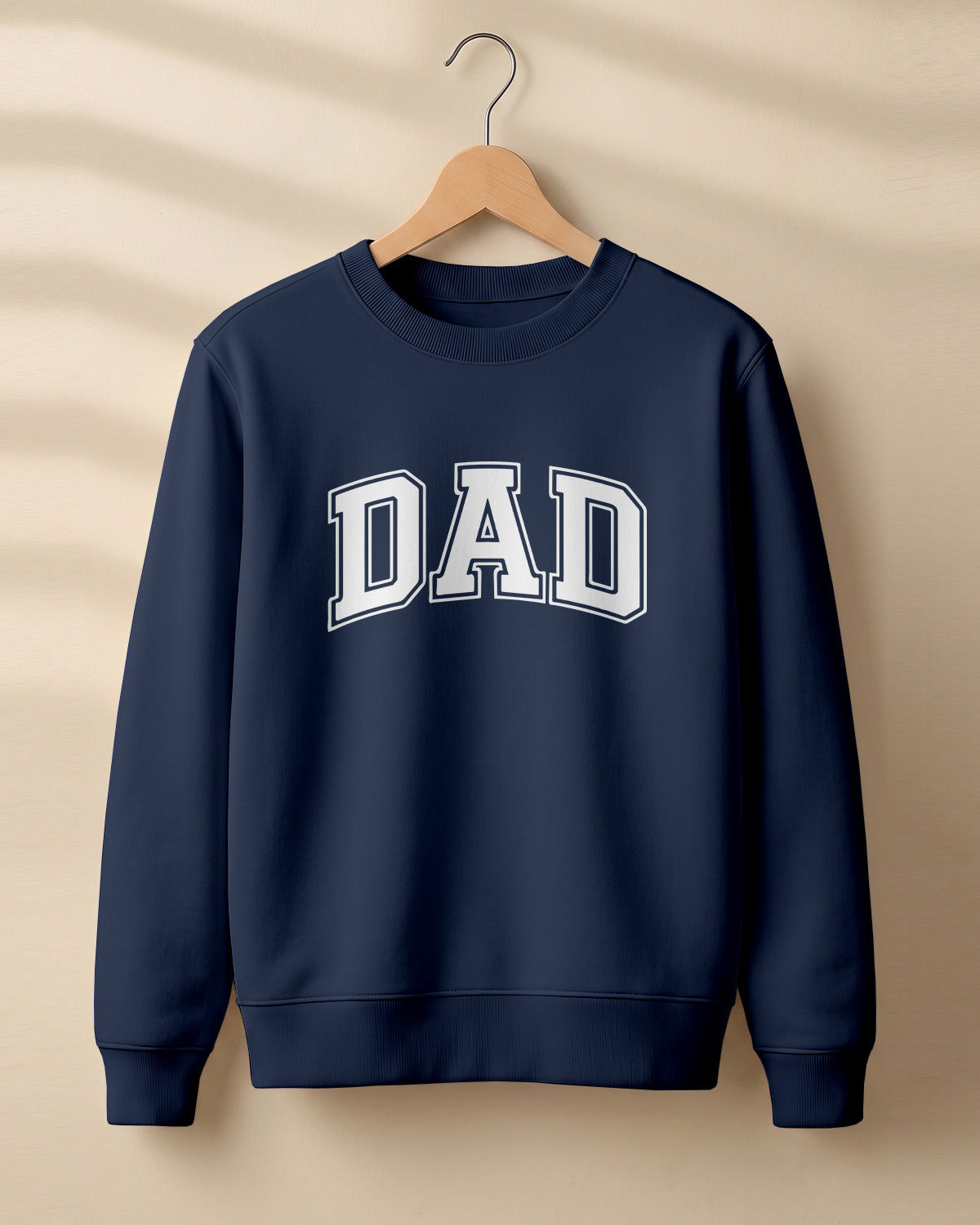 Xenovaurban graphic sweatshirt featuring bold varsity-style “DAD” typography.
