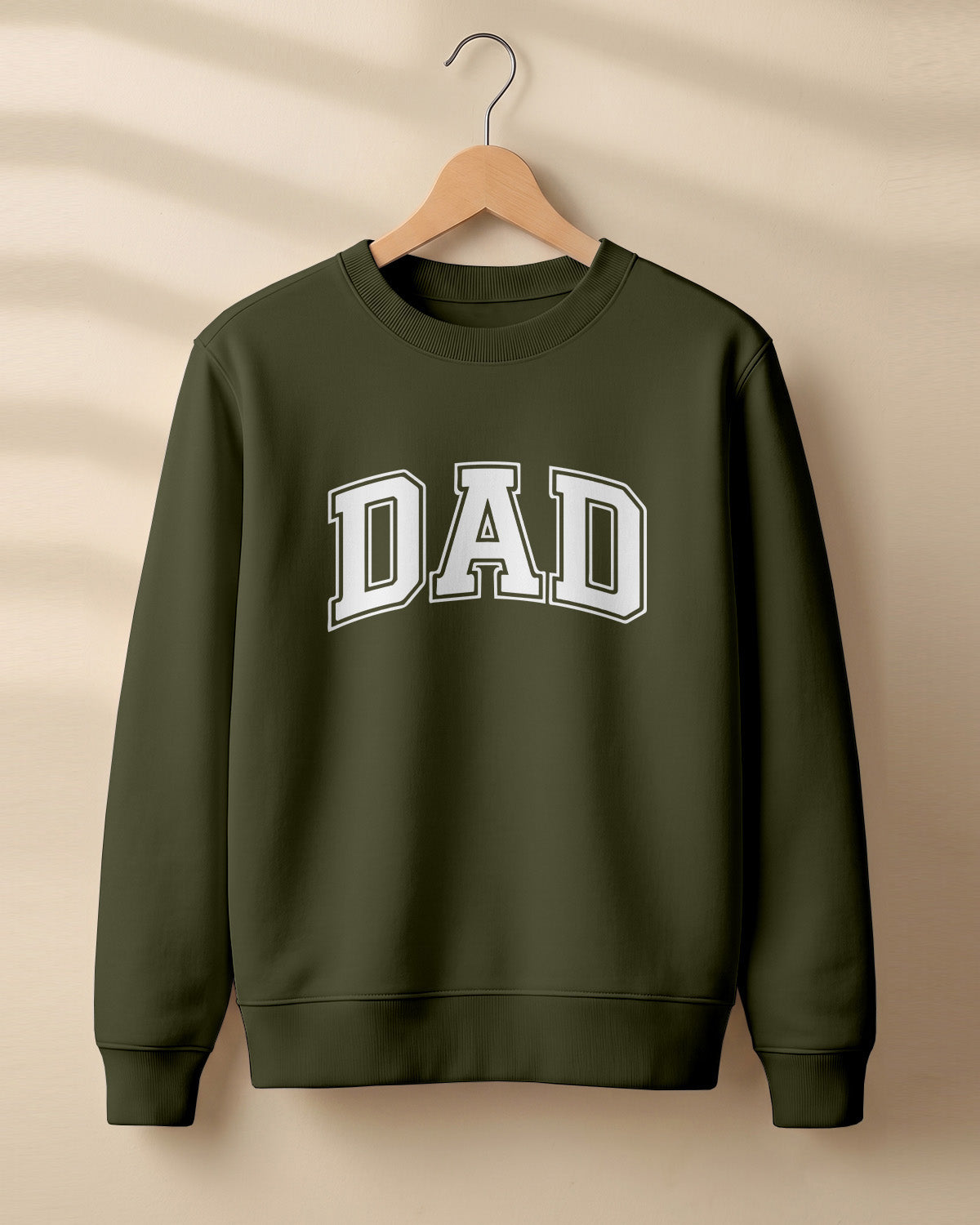 Xenovaurban graphic sweatshirt featuring bold varsity-style “DAD” typography.