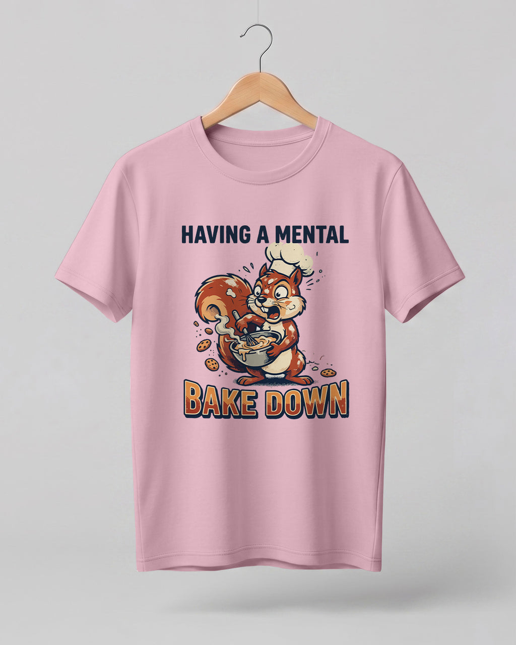 Foodie graphic half sleeve t-shirt featuring cartoon squirrel baking illustration with “Having a Mental Bake Down” typography printed on premium cotton fabric.