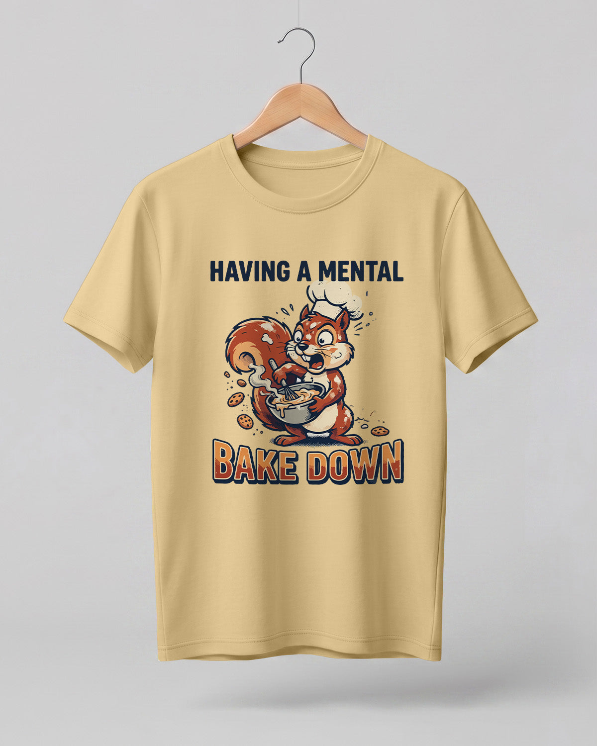 Foodie graphic half sleeve t-shirt featuring cartoon squirrel baking illustration with “Having a Mental Bake Down” typography printed on premium cotton fabric.