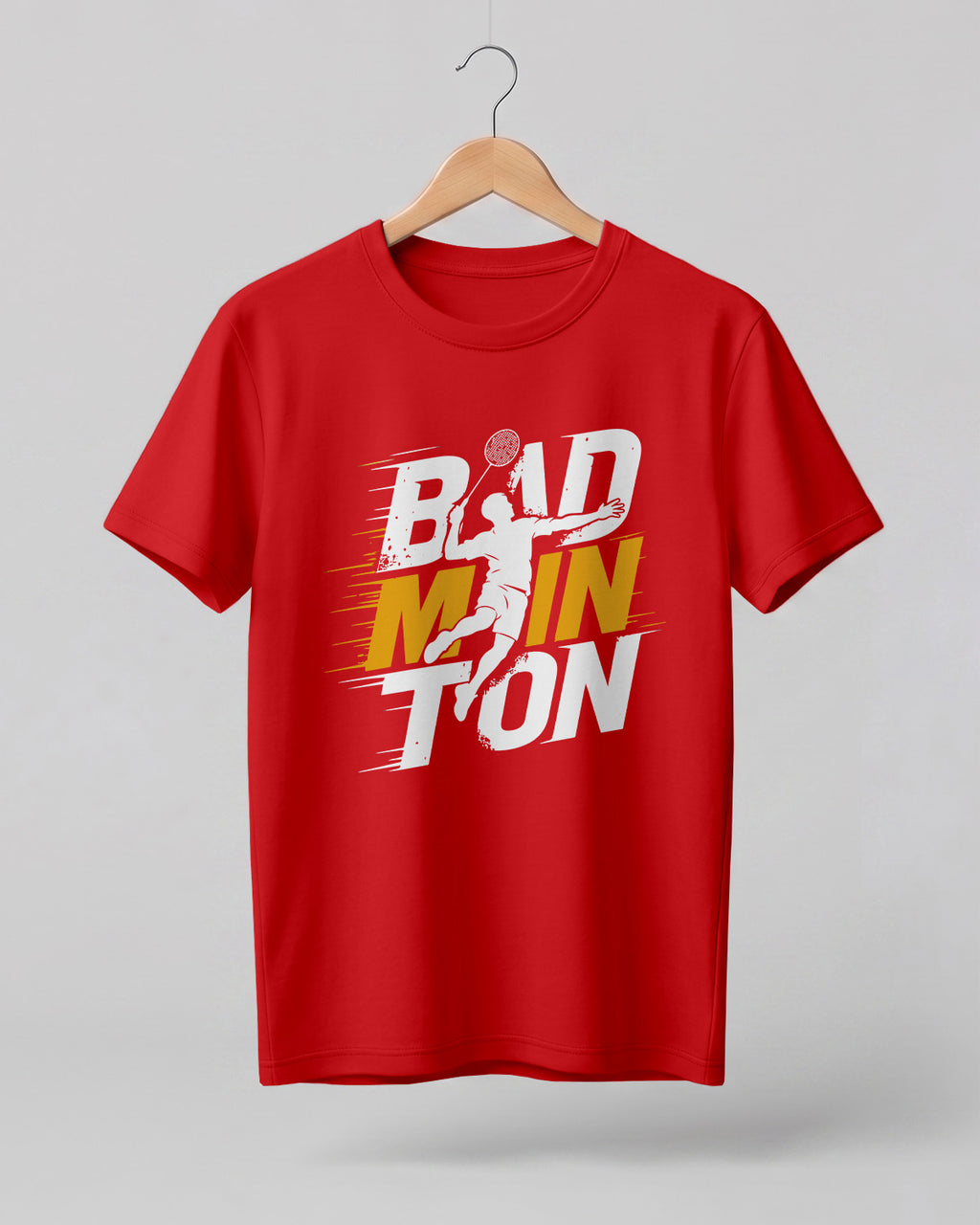 Motivational sports graphic half sleeve t-shirt featuring bold “Badminton” typography with dynamic player silhouette printed on premium cotton fabric.