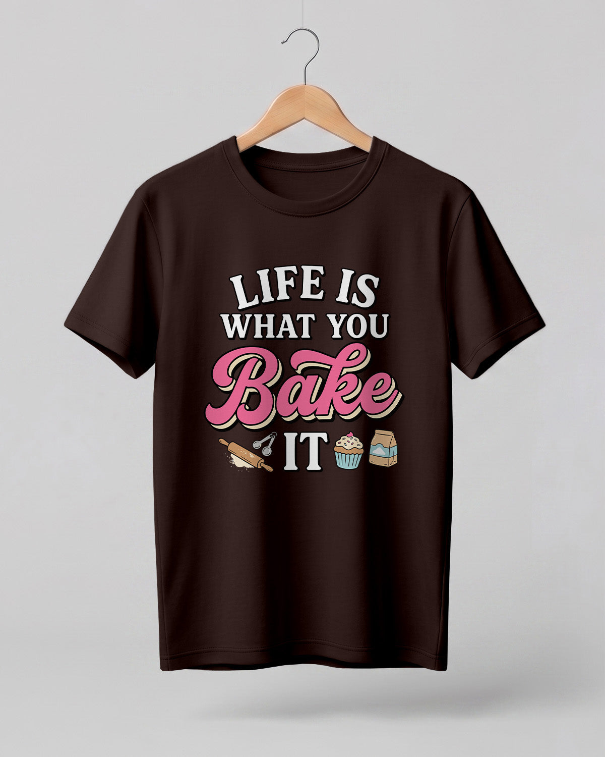 Foodie graphic half sleeve t-shirt featuring “Life Is What You Bake It” typography with colorful baking illustrations printed on premium cotton fabric.