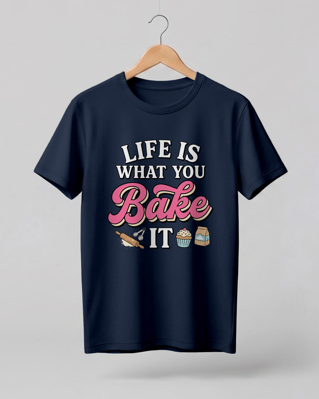 Foodie graphic half sleeve t-shirt featuring “Life Is What You Bake It” typography with colorful baking illustrations printed on premium cotton fabric.