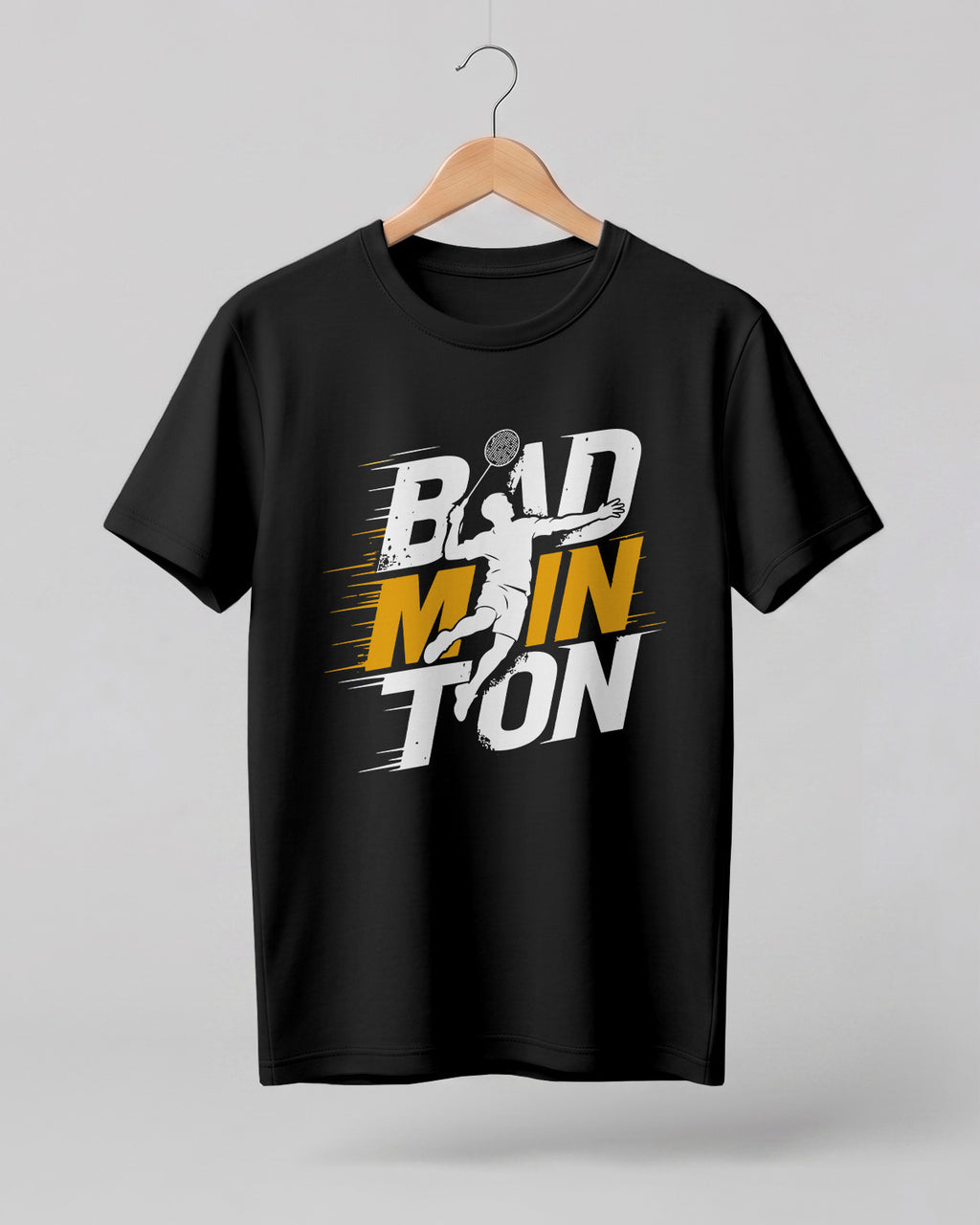 Motivational sports graphic half sleeve t-shirt featuring bold “Badminton” typography with dynamic player silhouette printed on premium cotton fabric.