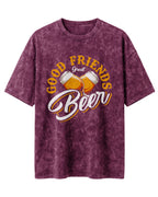 Xenovaurban 240 GSM heavyweight cotton oversized T-shirt featuring an illustration of two beer mugs clinking together with the text Good Friends, Great Beer