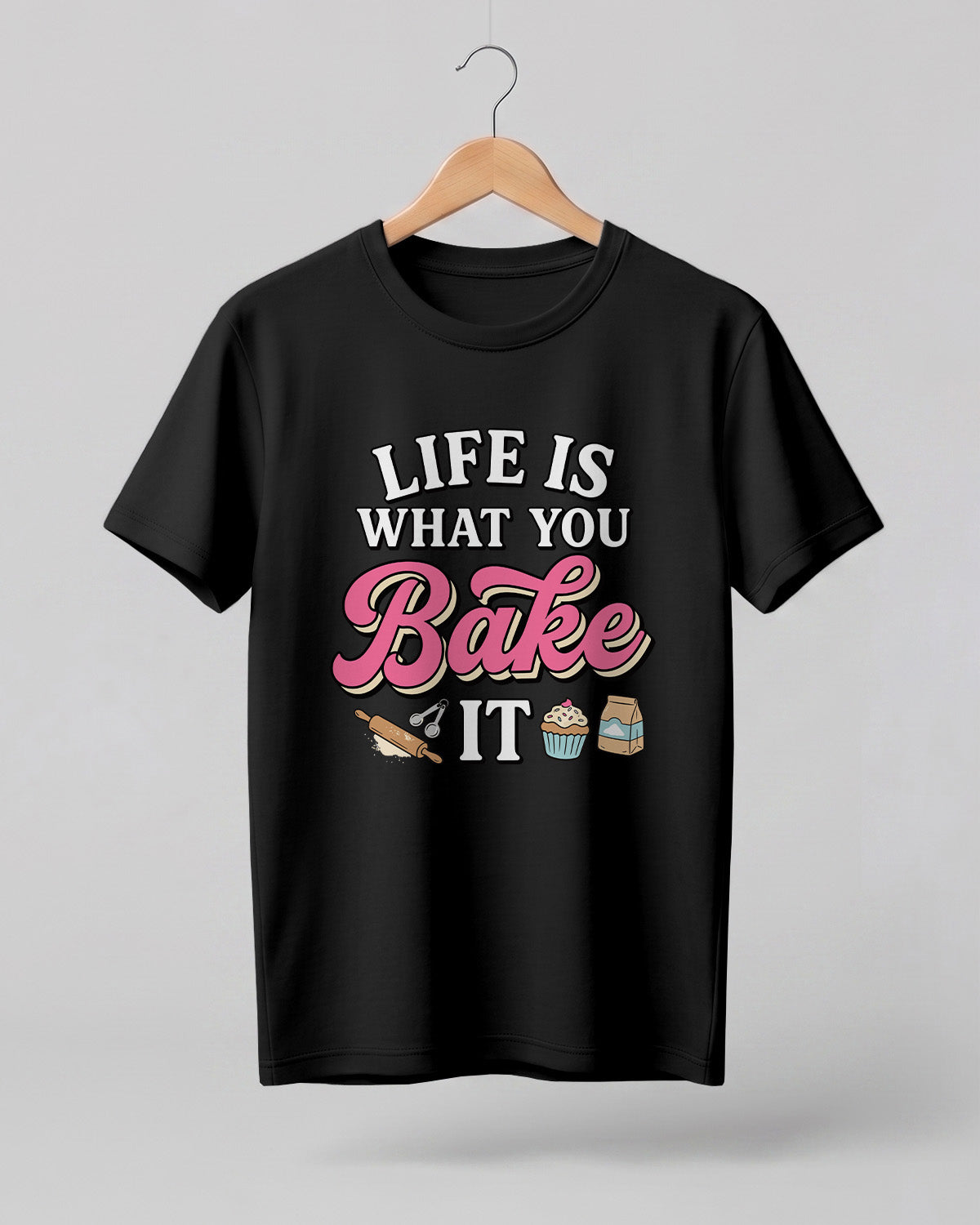 Foodie graphic half sleeve t-shirt featuring “Life Is What You Bake It” typography with colorful baking illustrations printed on premium cotton fabric.