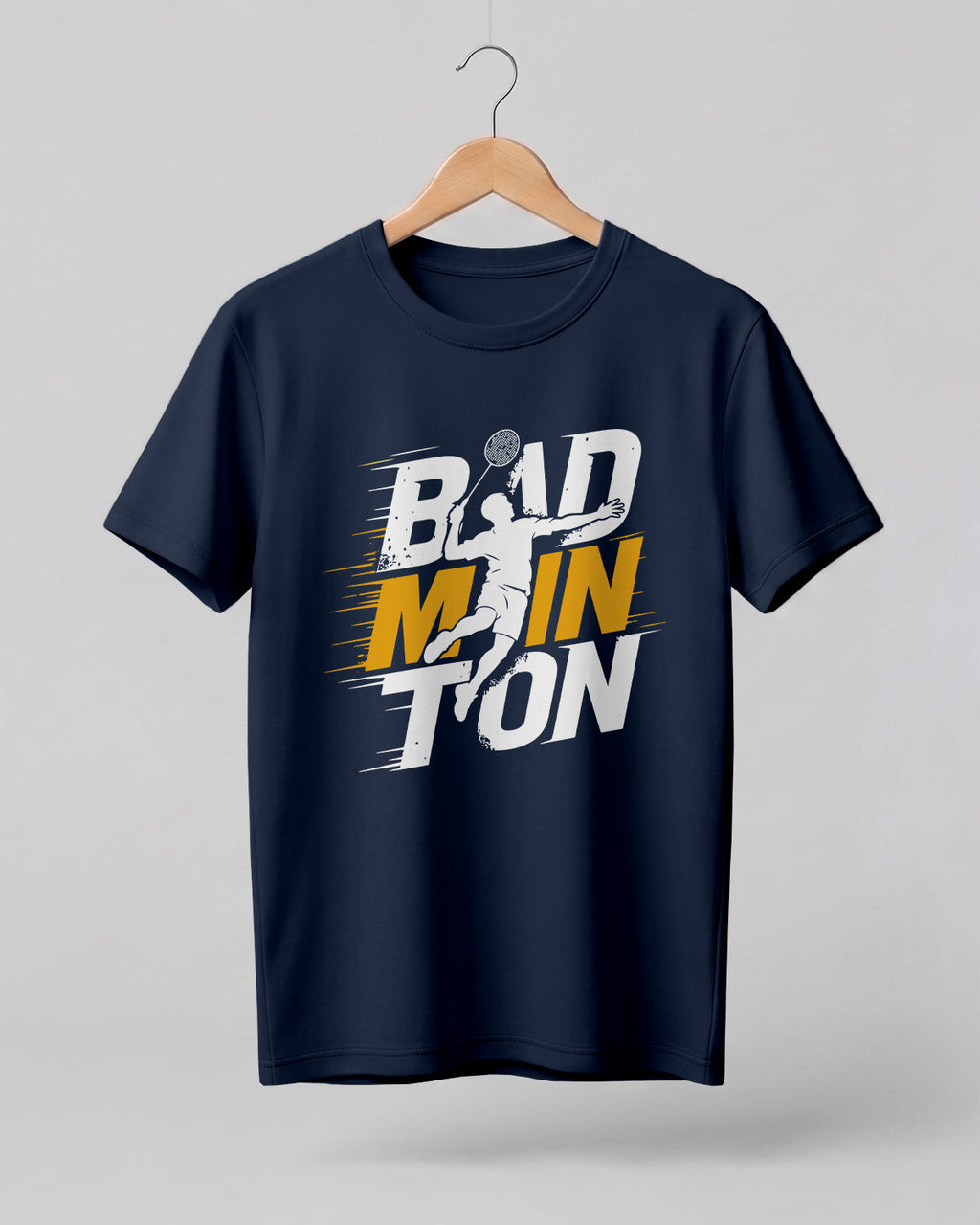 Motivational sports graphic half sleeve t-shirt featuring bold “Badminton” typography with dynamic player silhouette printed on premium cotton fabric.