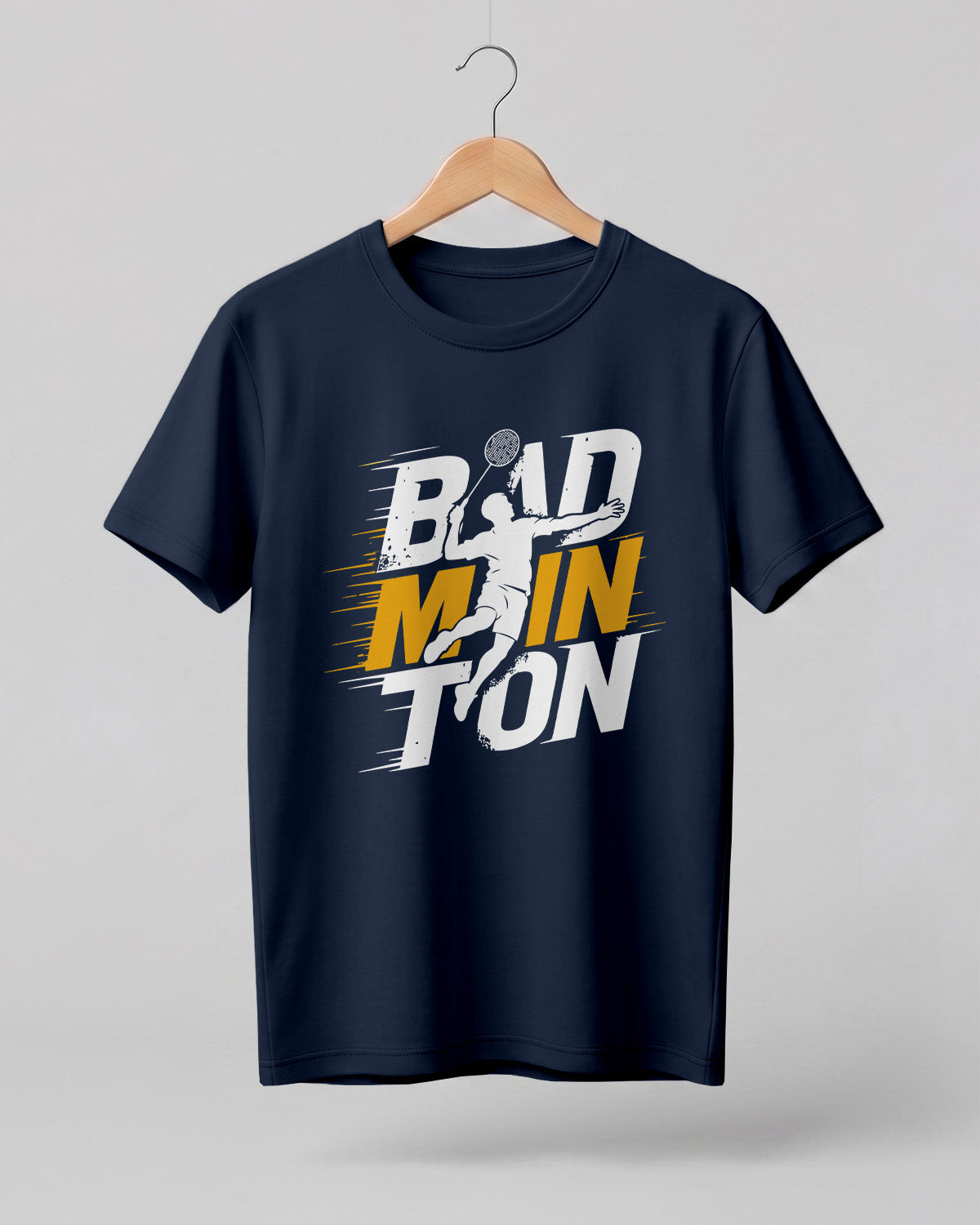 Motivational sports graphic half sleeve t-shirt featuring bold “Badminton” typography with dynamic player silhouette printed on premium cotton fabric.
