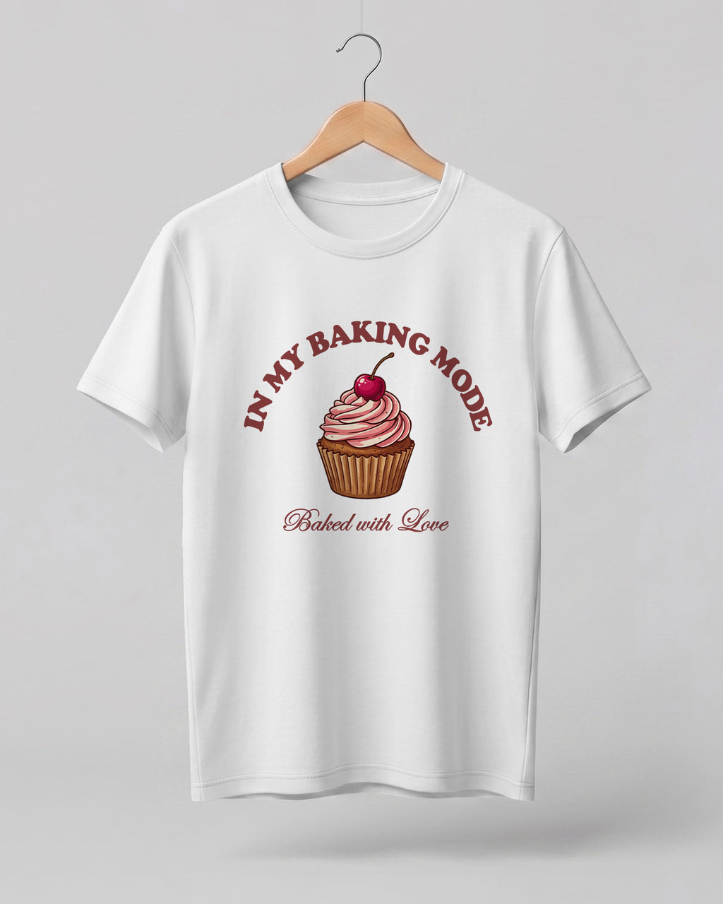 Foodie graphic half sleeve t-shirt featuring cupcake illustration with “In My Baking Mode” and “Baked with Love” typography printed on premium cotton fabric.