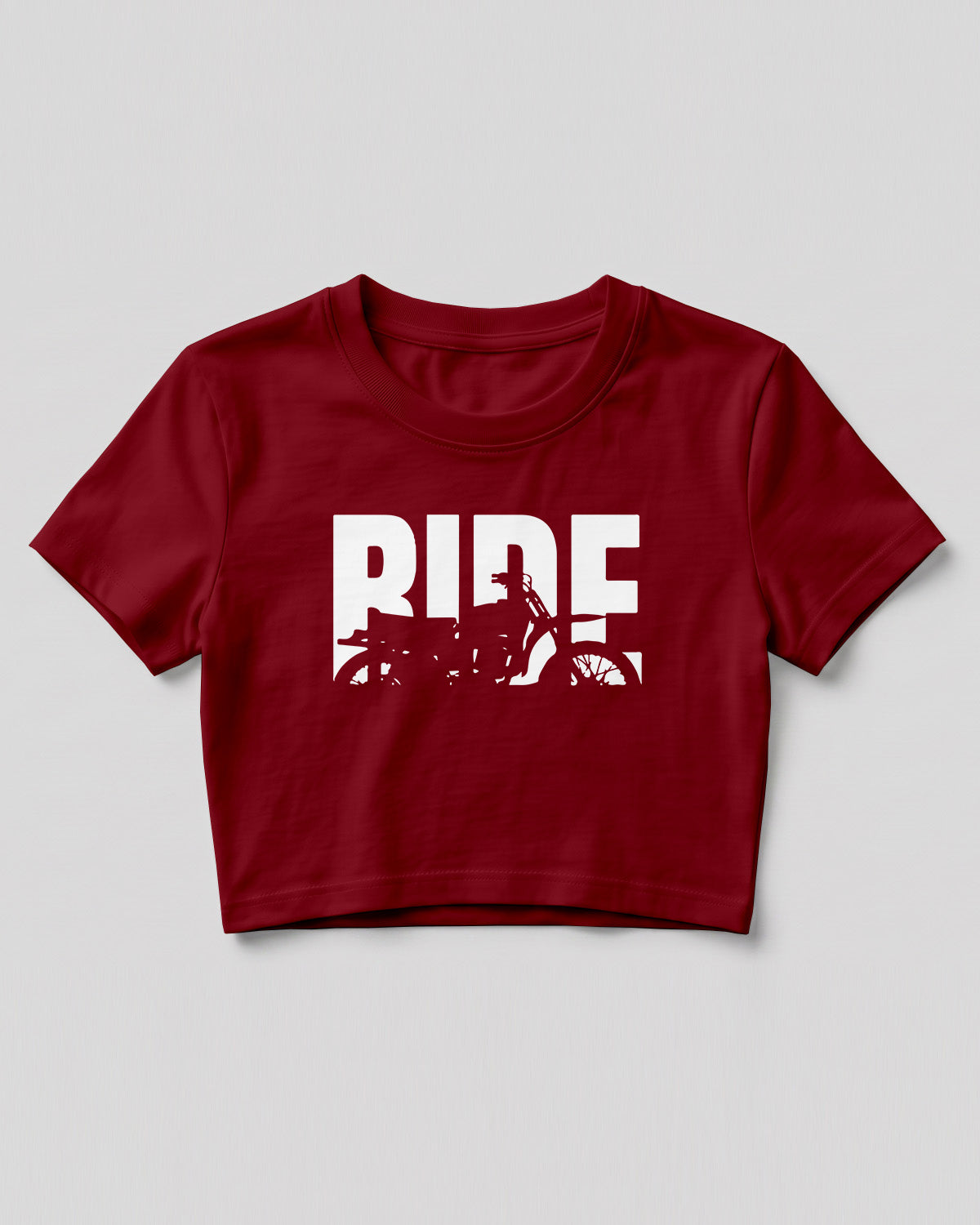 Xenovaurban crop top featuring oversized RIDE typography with a motorcycle silhouette integrated into the design