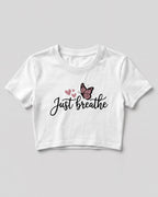 Motivational graphic crop top featuring Just Breathe typography design with butterfly artwork on cotton fabric