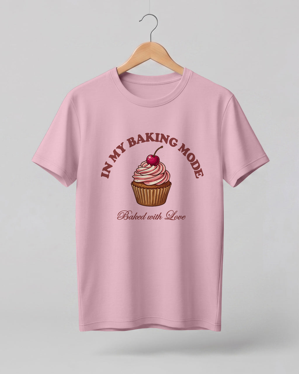 Foodie graphic half sleeve t-shirt featuring cupcake illustration with “In My Baking Mode” and “Baked with Love” typography printed on premium cotton fabric.