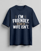 Sarcastic graphic half sleeve oversized t-shirt featuring I'm Friendly, But My Wife Isn't quote on cotton fabric