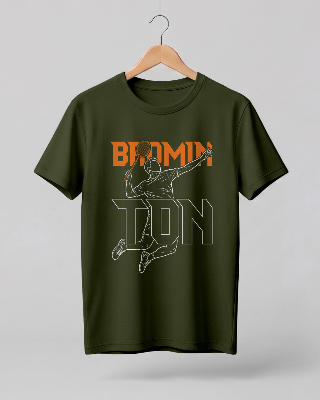 Motivational sports graphic half sleeve t-shirt featuring “Badminton” typography with player outline silhouette printed on premium cotton fabric.