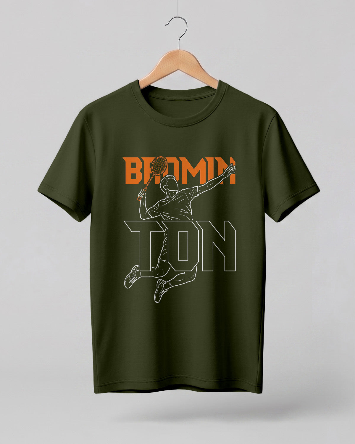 Motivational sports graphic half sleeve t-shirt featuring “Badminton” typography with player outline silhouette printed on premium cotton fabric.