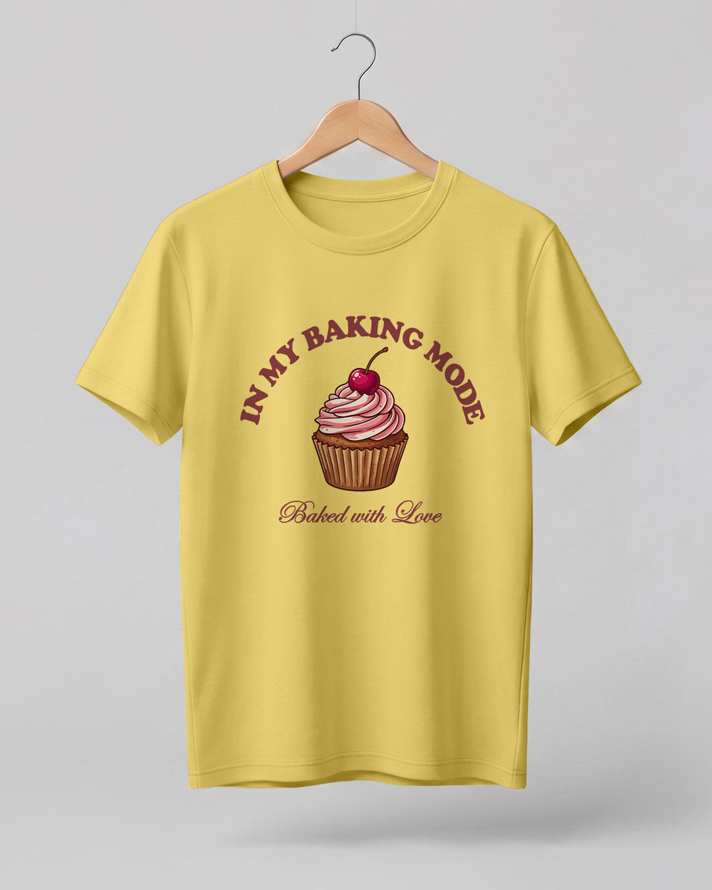 Foodie graphic half sleeve t-shirt featuring cupcake illustration with “In My Baking Mode” and “Baked with Love” typography printed on premium cotton fabric.