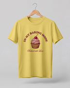 Foodie graphic half sleeve t-shirt featuring cupcake illustration with “In My Baking Mode” and “Baked with Love” typography printed on premium cotton fabric.