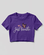 Motivational graphic crop top featuring Just Breathe typography design with butterfly artwork on cotton fabric