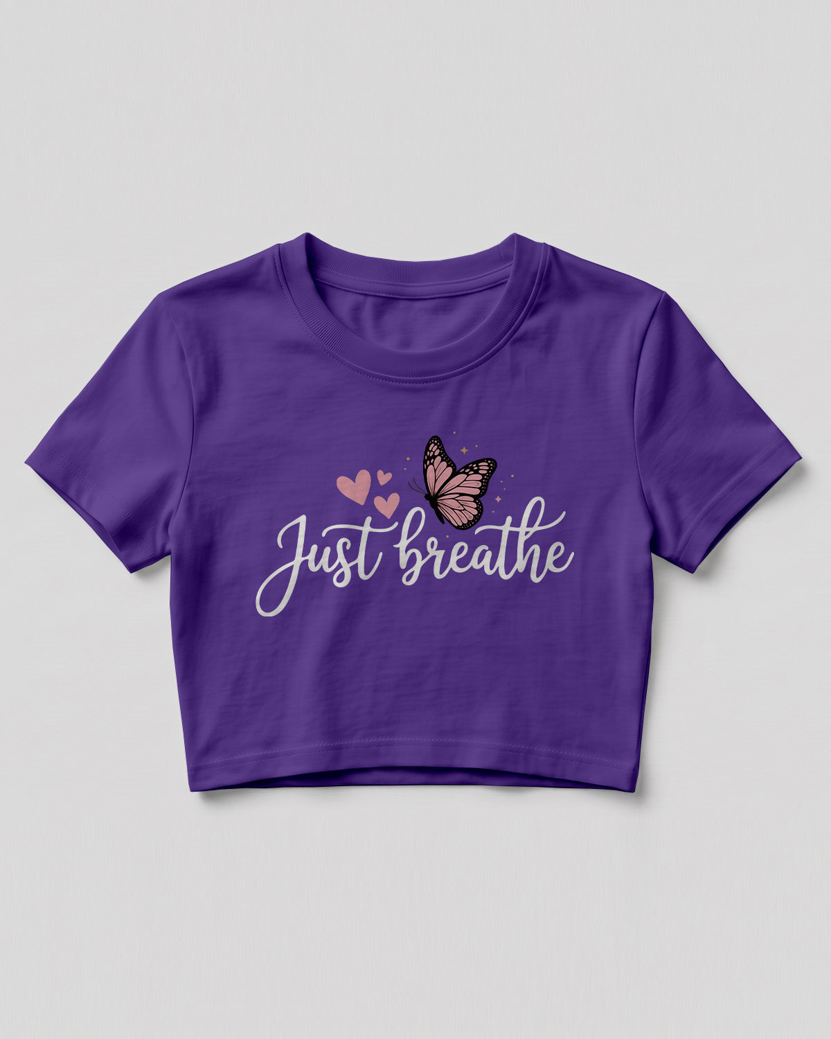 Motivational graphic crop top featuring Just Breathe typography design with butterfly artwork on cotton fabric