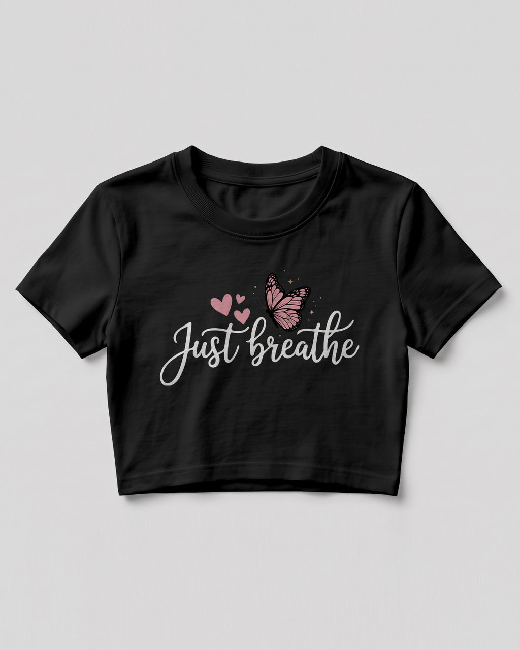 Motivational graphic crop top featuring Just Breathe typography design with butterfly artwork on cotton fabric