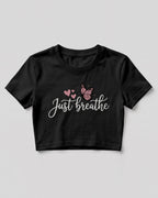 Motivational graphic crop top featuring Just Breathe typography design with butterfly artwork on cotton fabric