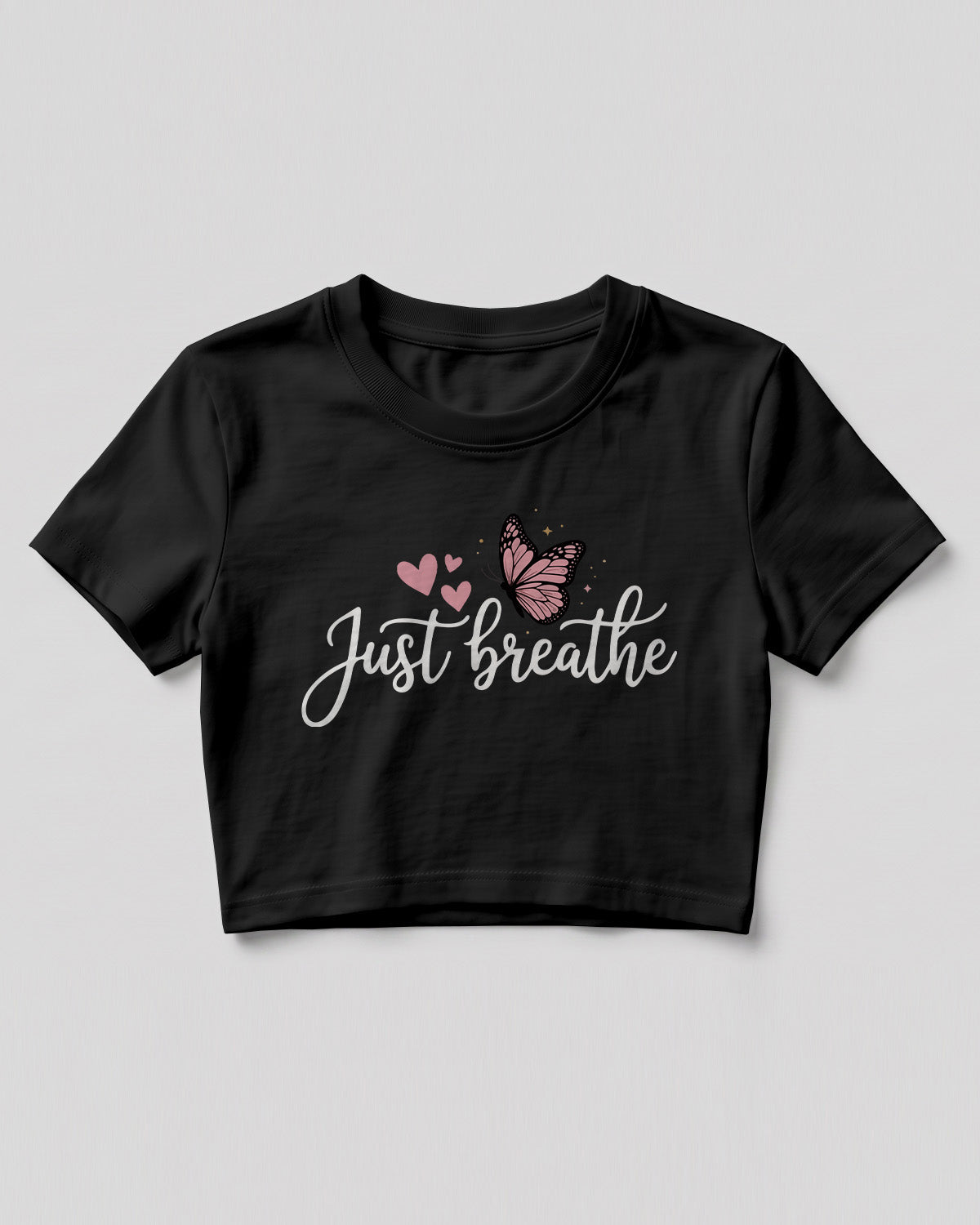 Motivational graphic crop top featuring Just Breathe typography design with butterfly artwork on cotton fabric