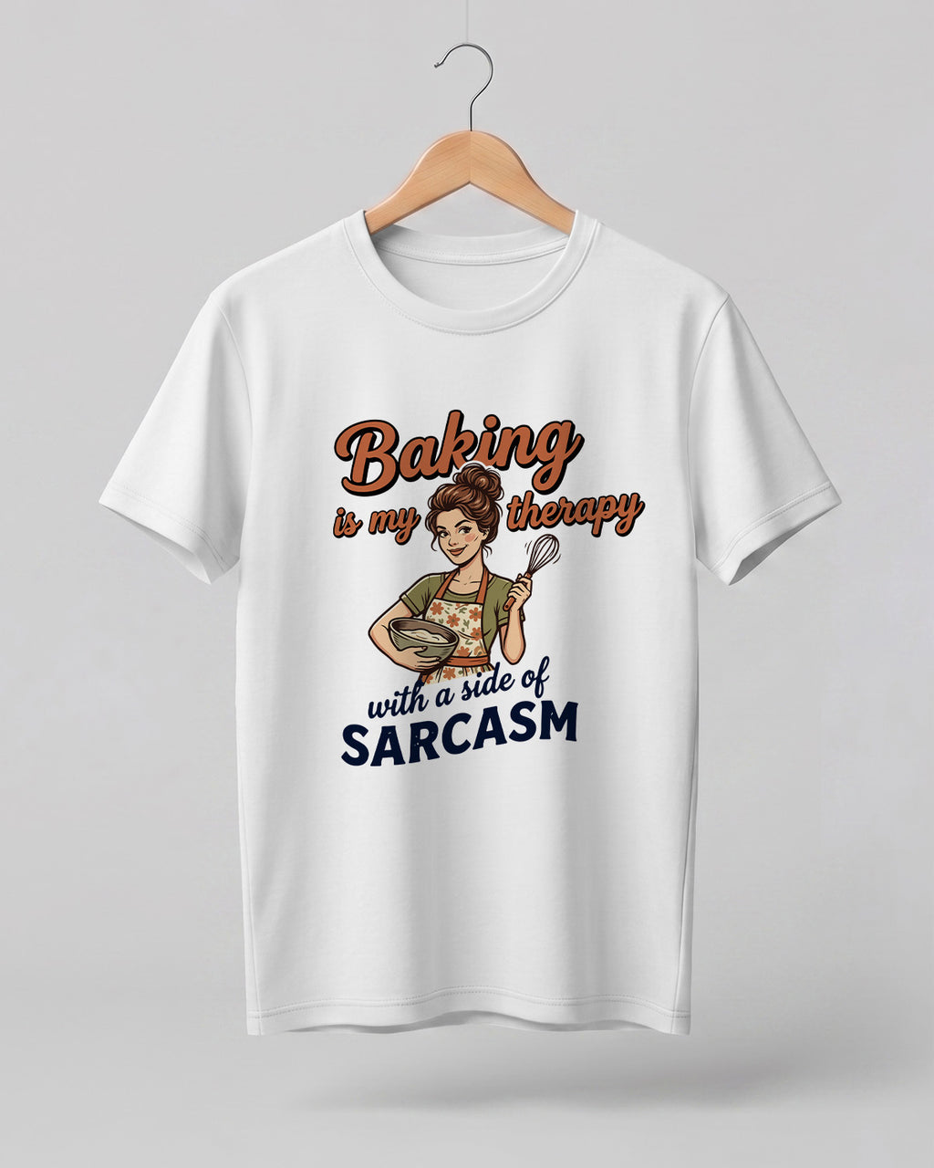 Foodie graphic half sleeve t-shirt featuring cartoon baker illustration with “Baking Is My Therapy with a Side of Sarcasm” typography printed on premium cotton fabric.