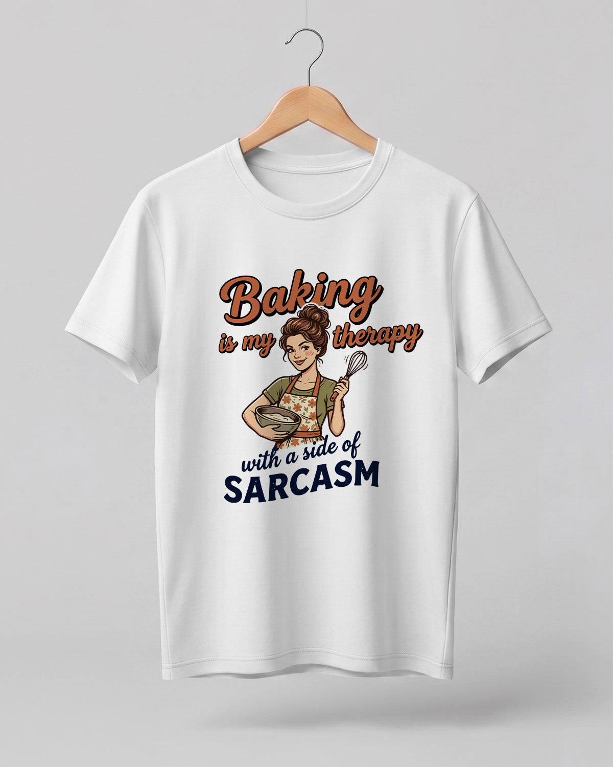 Foodie graphic half sleeve t-shirt featuring cartoon baker illustration with “Baking Is My Therapy with a Side of Sarcasm” typography printed on premium cotton fabric.