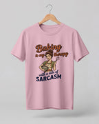 Foodie graphic half sleeve t-shirt featuring cartoon baker illustration with “Baking Is My Therapy with a Side of Sarcasm” typography printed on premium cotton fabric.