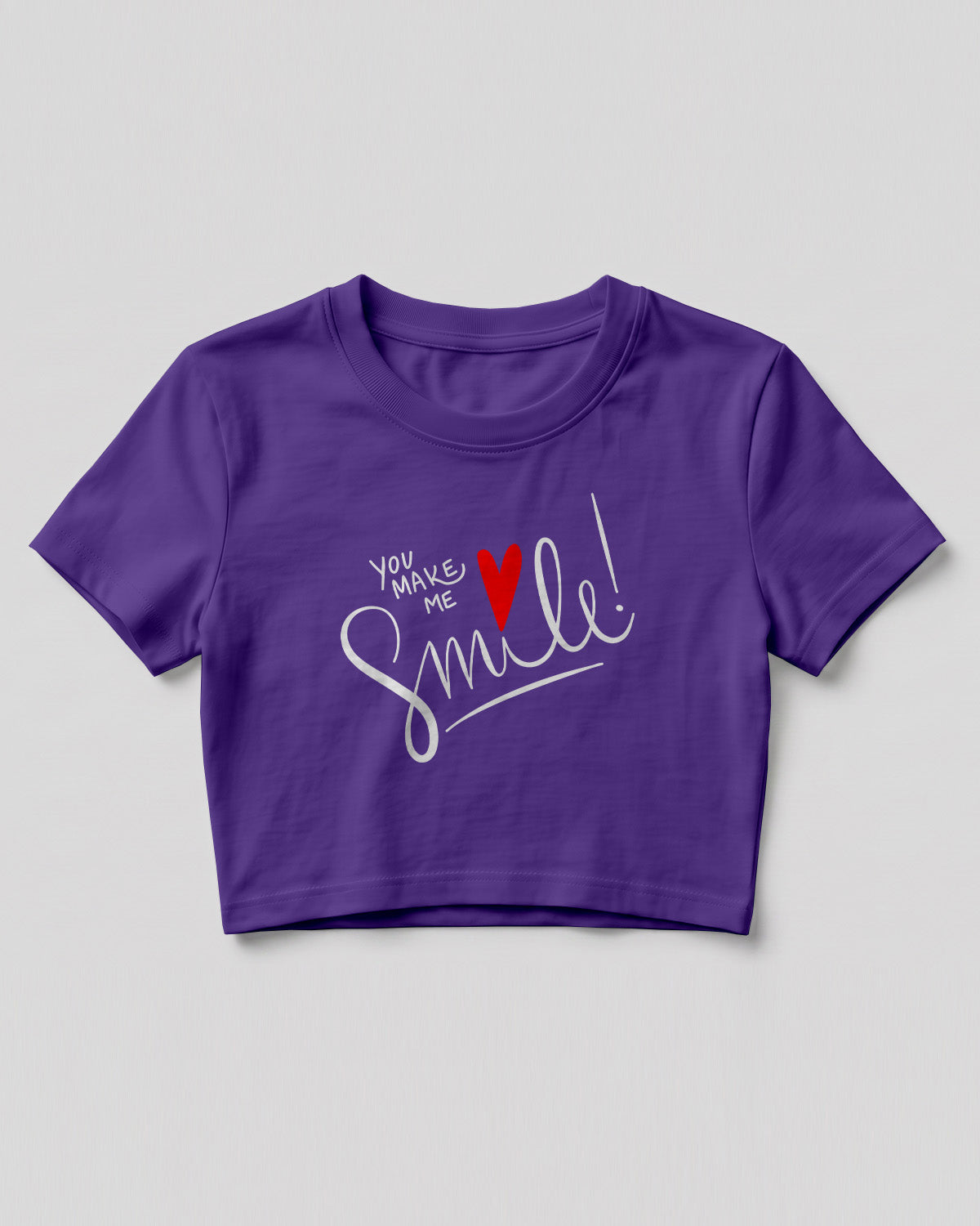 Motivational graphic crop top featuring You Make Me Smile typography design with heart graphic on cotton fabric