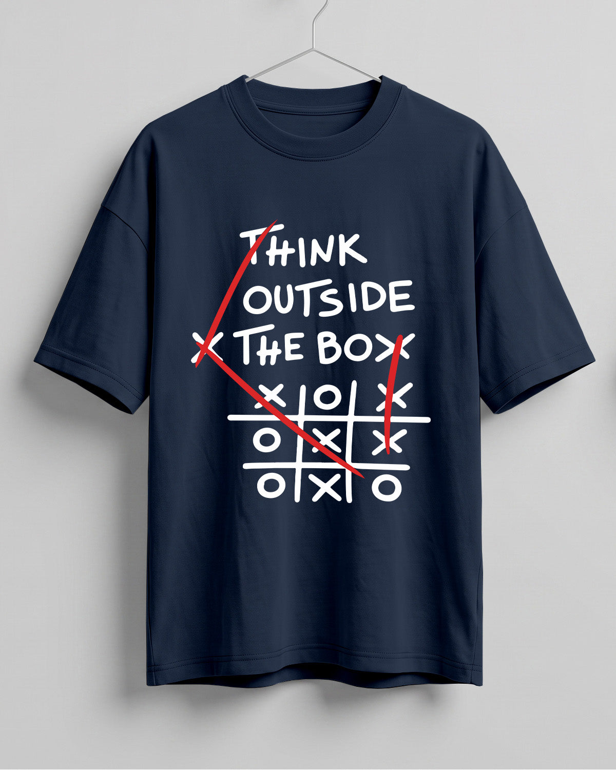 Graphic half sleeve oversized t-shirt featuring Think Outside the Box quote with tic-tac-toe graphic on cotton fabric